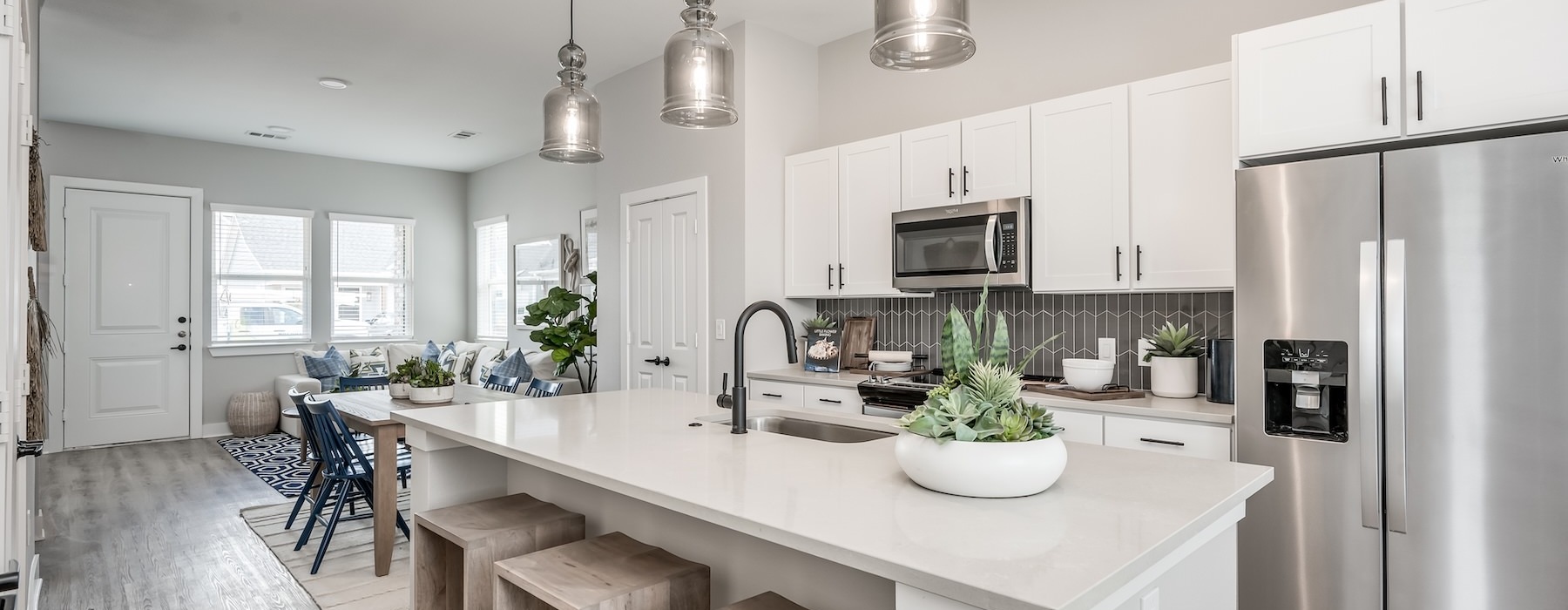 a kitchen with white cabinets