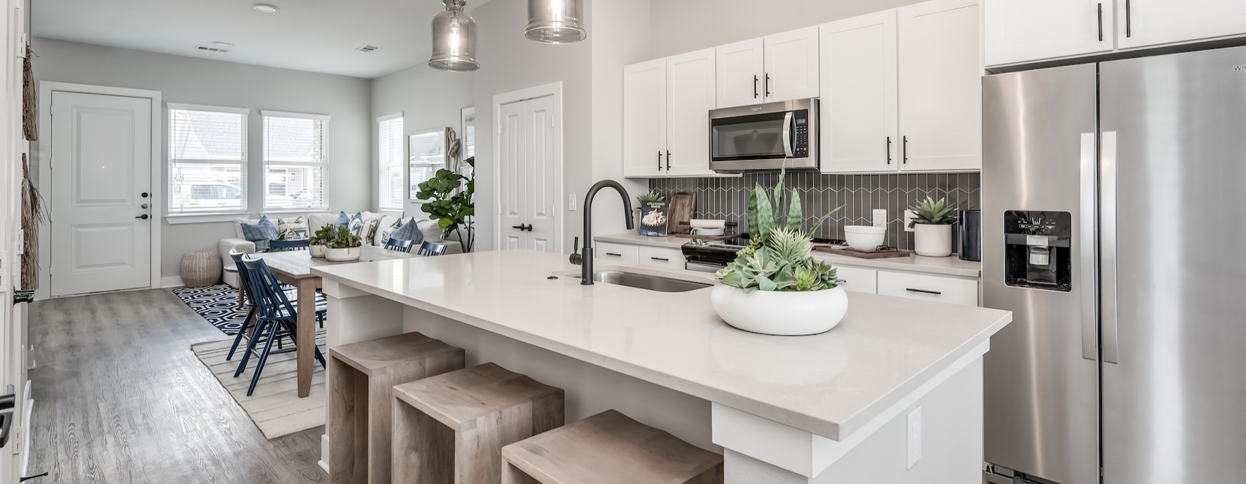 a kitchen with white cabinets